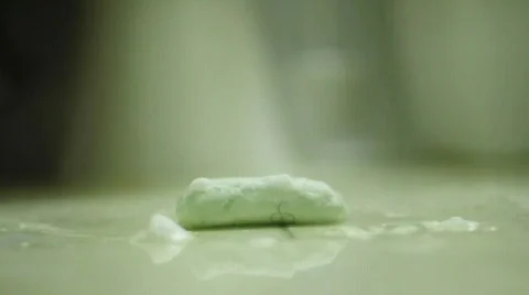 Foot steps over soap on floor Stock Footage 544295