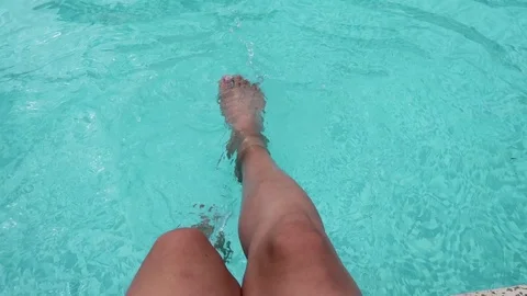 Foot in swimming pool, holiday  Stock Footage
