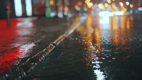 The foot of an unrecognizable person steps into a puddle, breezes fly Stock Footage 243850908