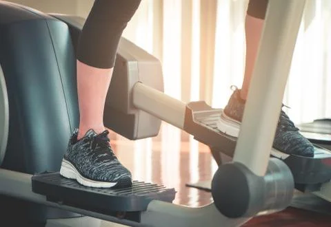 Foot working out on stepper exercise machine Stock Photos