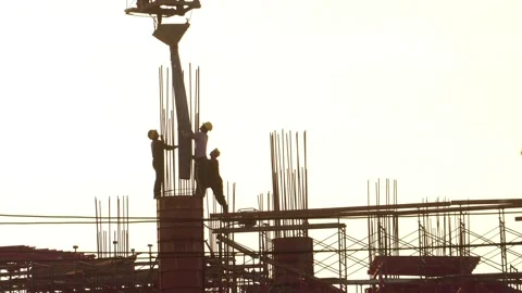 Footage 4K: Construction worker in Construction Site at Sunset  Stock Footage 142590669