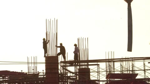Footage 4K: Construction workers against sunset Stock Footage 142590187