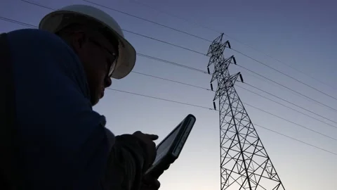 Footage 4K: Engineer checks the work of electricity pylon Stock Footage 147933021