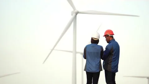 Footage 4K: engineers and technician are talking about wind turbine Stock Footage 144894288