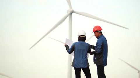 Footage 4K: engineers and technician are talking about wind turbine Stock Footage 144894496
