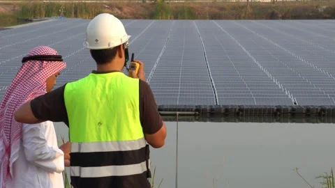 Footage 4K: Middle Eastern Arabs inspecting solar farms with engineers Stock Footage 232489401