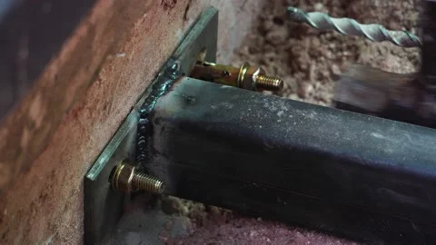 Footage 4K: A technician's hand is working on concrete and steel construction Stock Footage 138752199