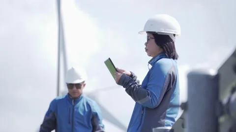 Footage 4K: Two engineers are talking about wind turbine system Stock Footage 133124663