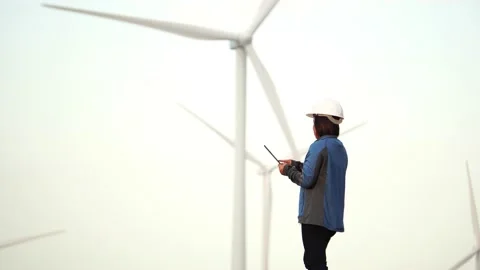 Footage 4K: Windmills and engineer Stock Footage 144894269