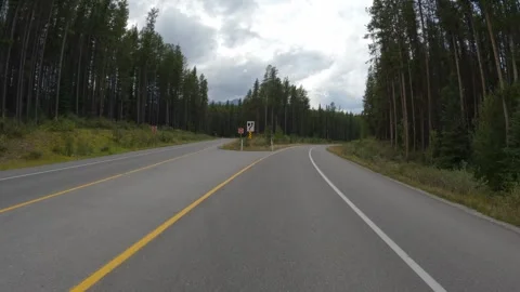 Footage from an action camera mounded on the front of a car driving near Banff Stock Footage 285889586