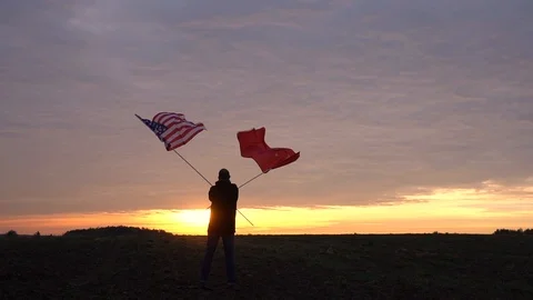 Footage of American and Chinese flags blowing in the wind. waving flags in a Stock Footage