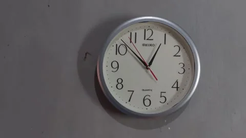 Footage of an analog quartz wall clock made in Japan Stock Footage 326195099