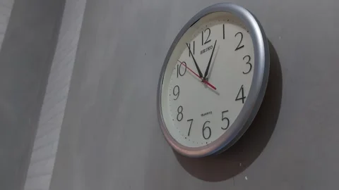 Footage of an analog quartz wall clock made in Japan Stock Footage 326195308