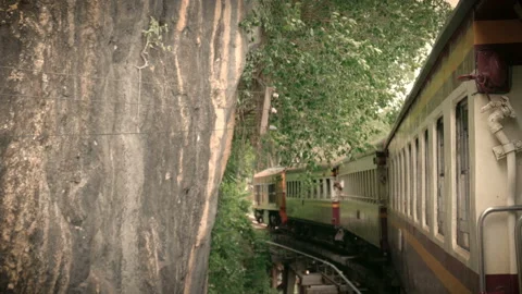 Footage of an ancient train running on a sharp curved rail curving Stock Footage 134055874