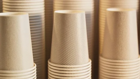Footage of assorted disposable cups. Stacks of cups. Close up. Panning around Video stock 133471481