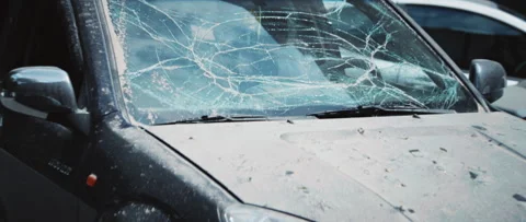 Footage of beautiful vehicle with broken windshield and glass fragments on hood Stock Footage 280139836