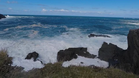 Footage of big waves crashing into rocks Stock Footage