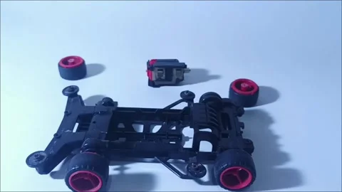 Footage of Black Plastic Chassis Frame for Miniature 4WD Toy Racing Car Video stock 328567169