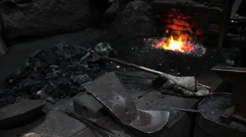 Footage of a blacksmith workplace with an oven in the background Stock Footage 43563398