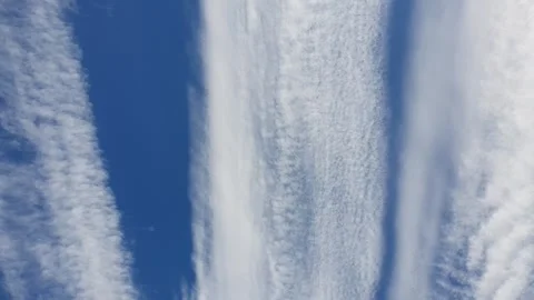 Footage of blue sky with interesting clouds in the shape of chemtrails trace. Stock Footage 269345280