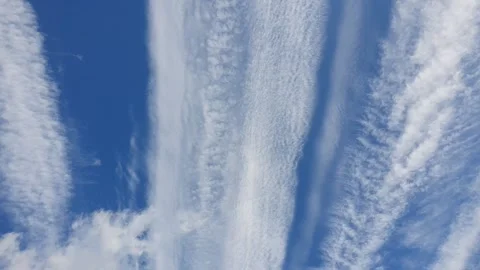 Footage of blue sky with interesting clouds in the shape of chemtrails trace. Stock Footage 269345283