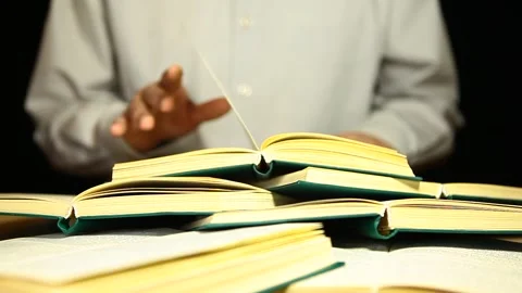 Footage of book hand dark background Stock Footage 241490873