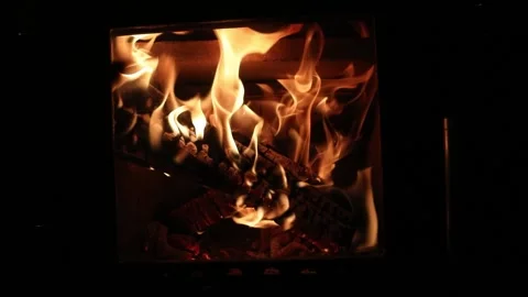 Footage of a bright colored dancing flames in fireplace. Close up of burning Stock Footage 175353352