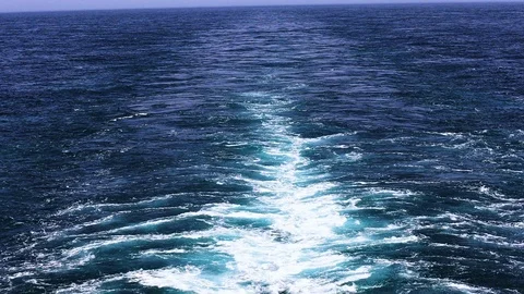 Footage of Bubbles and blue ocean view from the back of a ship in summer Stock Footage 103184471