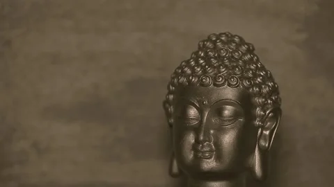 Footage of buddha head sharp wall background Stock Footage 149883691
