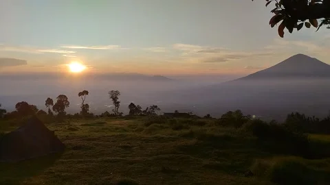 Footage captures the atmosphere of the sun setting in the morning Stock Footage 307613345