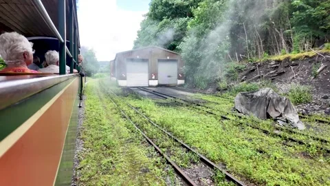 Footage capturing a powerful steam train as it leaves the historic South Stock Footage 339378590
