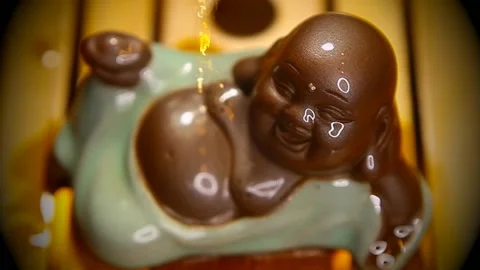 Footage of ceramic statue tea bamboo desk background Stock Footage 233160628