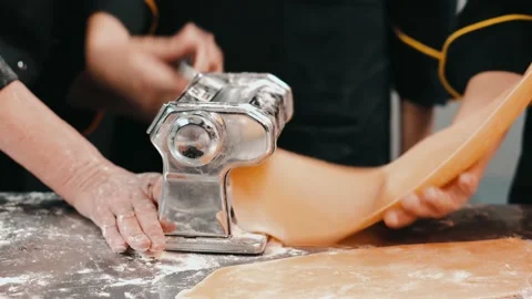 Footage of chef in kitchen preparing dough with machine for pasta and lasagna Stock Footage 161348627