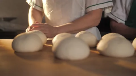 Footage of chef making dough for donuts or pizza. Stock Footage 168533371