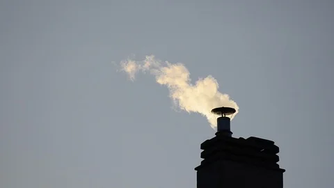Footage of a chimney of the condominium heating system. The low rays of the Stock Footage 102867215