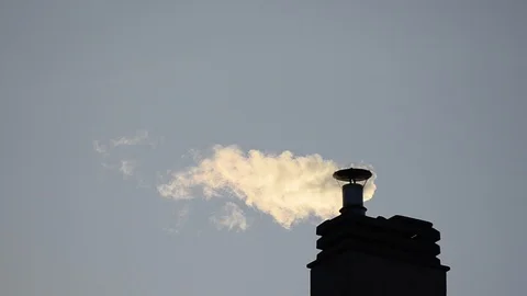 Footage of a chimney of the condominium heating system. The low rays of the Stock Footage 102867219