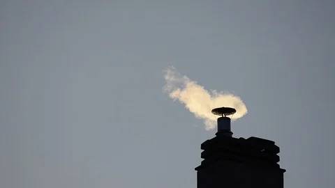 Footage of a chimney of the condominium heating system. The low rays of the Stock Footage 102867285