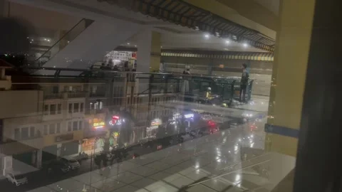 Footage Of City View From A Building Window At Night Video stock 344798636