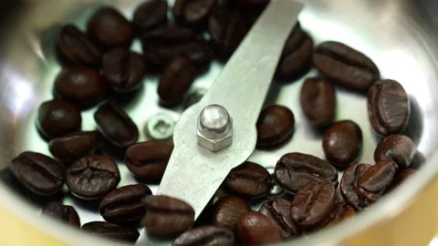 Footage close-up coffee beans poured into coffee grinder. Stock Footage 122371458