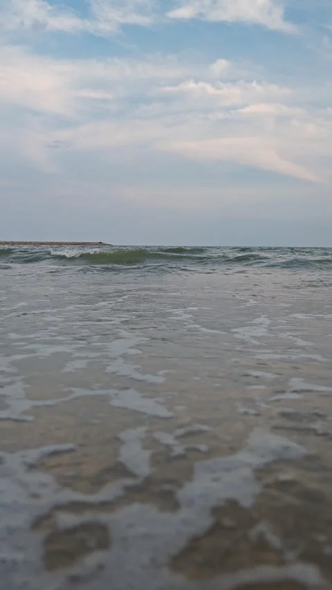 Footage Close-up of Sea Waves with White Foam Splashes on Sand  Video stock 317460253