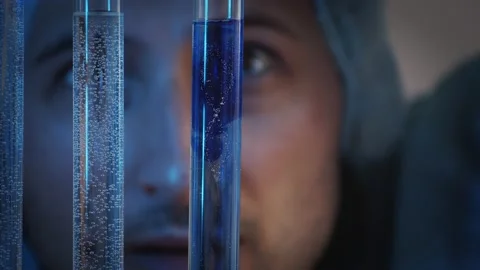 Footage computer graphics and video. Three test tubes in one of which rotate blu Stock Footage 233030088