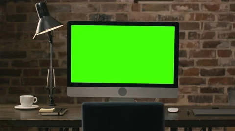 Footage of a computer monitor with green screen standing on a table Stock Footage