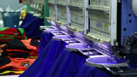 Footage of Computerized embroidery machine in progress embroidery logo on T-shir Video stock 145634312