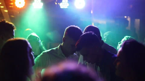Footage from a crowd or group of young people during a colorful party Stock Footage 123573221