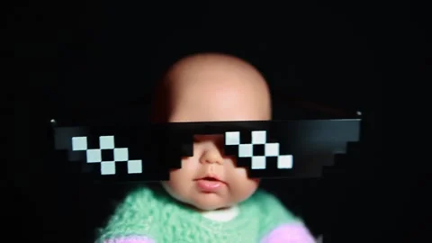 Footage of doll sunglasses dark background Stock Footage 298534053