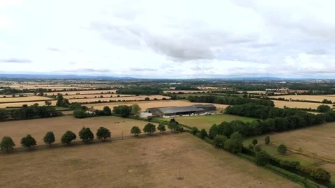 Footage of Drone Farm Cotswalds 2 on a UK farm during harvest season, showing ag Stock Footage 321754344
