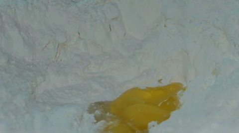Footage eggs falling into flour. hd Stock Footage 67660374