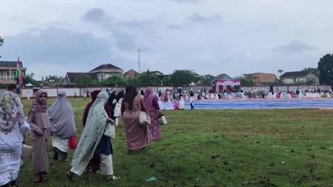 The footage of Eid Mubarak prayer in the field Stock Footage 239123498