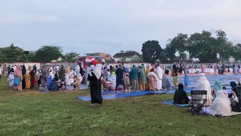The footage of Eid Mubarak prayer in the field yard Stock Footage 239123521
