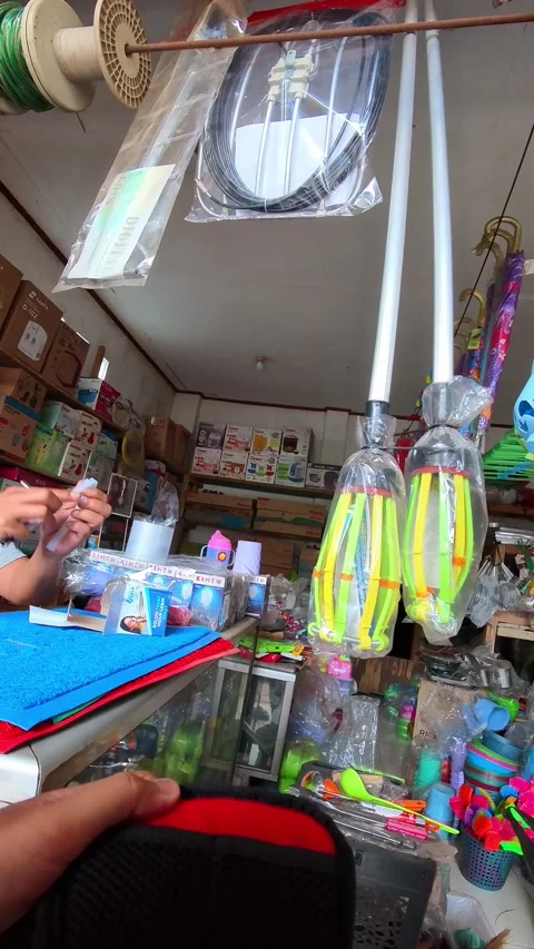 Footage of an electronics store clerk serving a customer Stock Footage 325516883